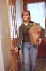 Woman opening wooden door while carrying bag of groceries 1.jpg