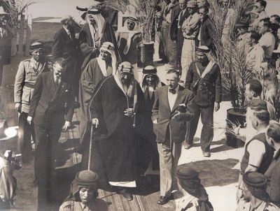 A photograph taken in 1947 in Dhahran shows the first king of modern Saudi Arabia, Abdul Aziz Ibnsaud, center left, with James McPherson, the president of the Arabian American Oil Co., Aramco, center right. 
 Courtesy Photo  
   
