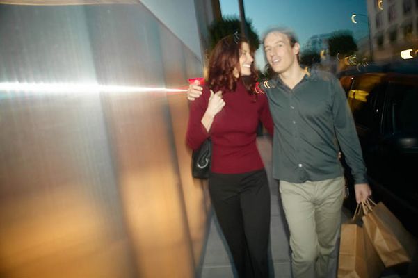 Adult couple walking together with shopping bags uid 1437923.jpg