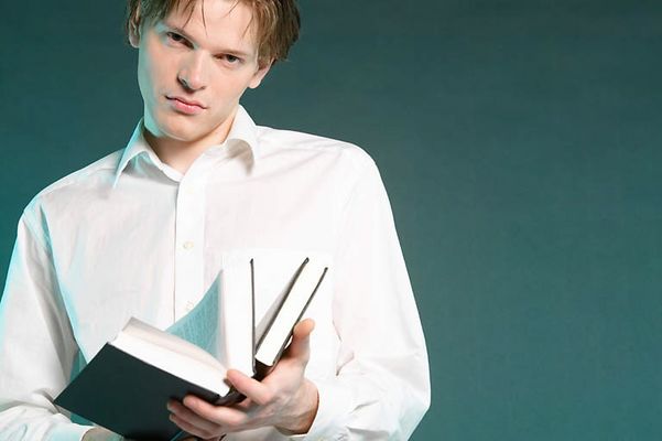 Angry male adult holding book.jpg