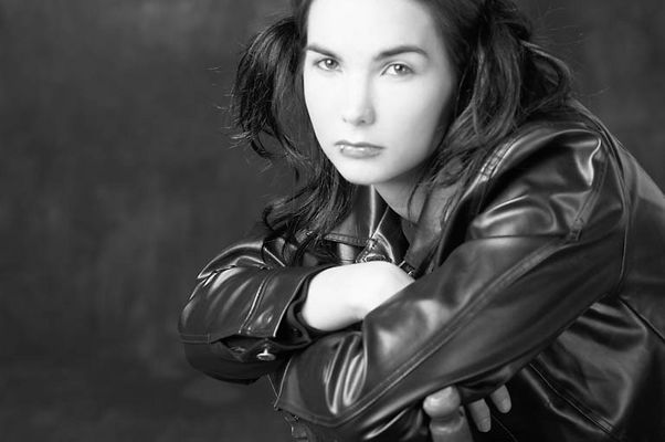 Angry woman in black leather jacket.jpg