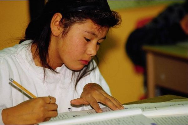 Asian girl writing.jpg