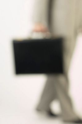 Blur of businessman walking with briefcase.jpg