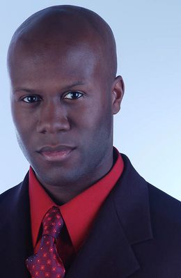 Businessman in red shirt and tie.jpg