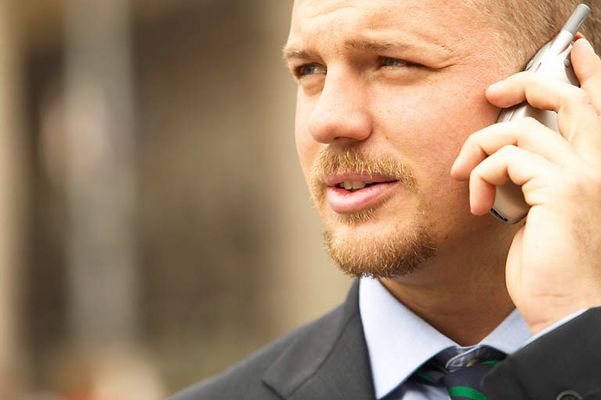 Businessman on cell phone uid 1433193.jpg