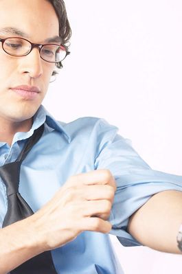 Businessman rolling up his sleeves.jpg