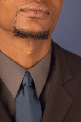 Businessman with goatee wearing blue tie.jpg