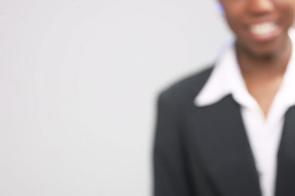 Businesswoman in black suit with white collar.jpg