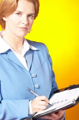 Businesswoman writing in day planner 200.jpg