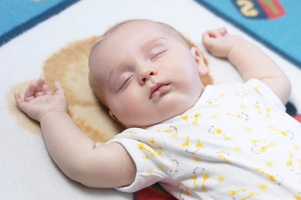 Caucasian baby sleeping on mat.jpg