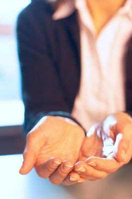 Caucasian businesswoman cupping hands.jpg