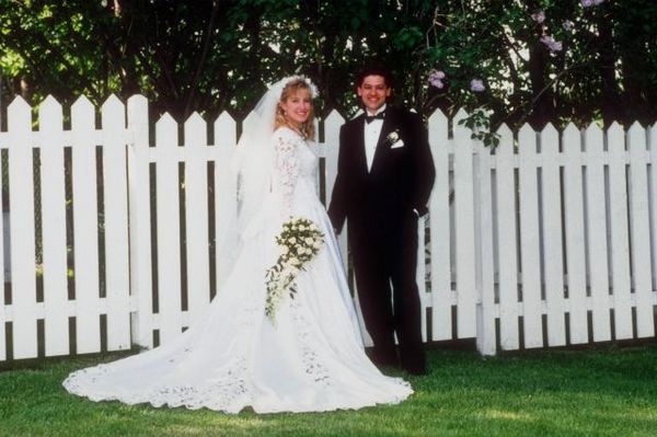 Couple standing in front of fence.jpg