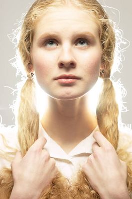 Light shining behind woman with her hair in braids.jpg