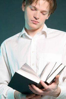 Male adult reading book uid 1453924.jpg
