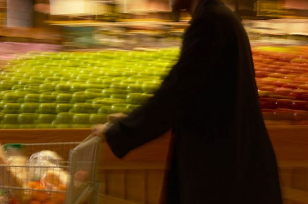 Man grocery shopping in a blur.jpg