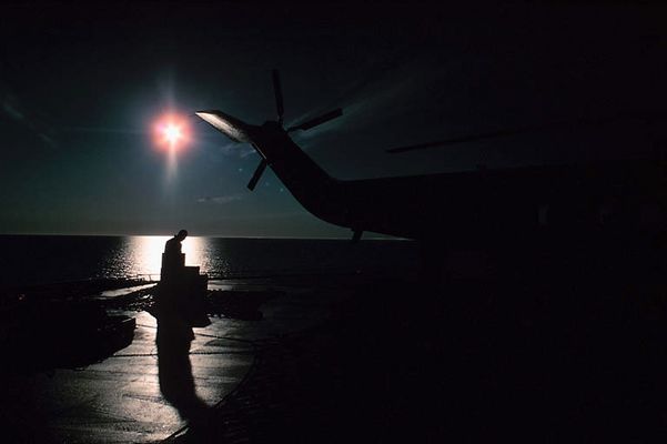 Man in silhouette at dock in North West Territories Tuktut Nogait 2.jpg