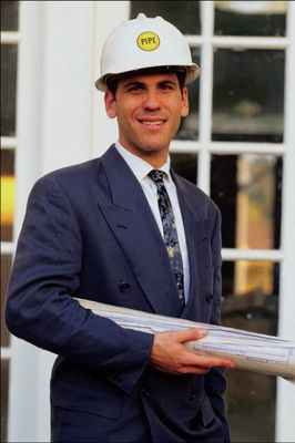 Man in suit with blueprints.jpg