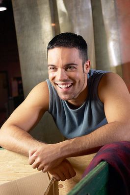 Man leaning against crate laughing uid 1280671.jpg