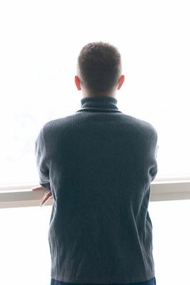 Man looking out a window.jpg