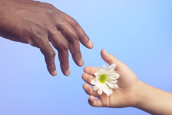 Person offering flower 0002.jpg