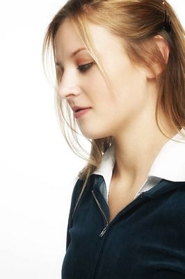 Profile of a young blonde woman with a white background.jpg