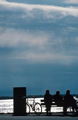 Silhouette of people city on bench along seashore 1.jpg