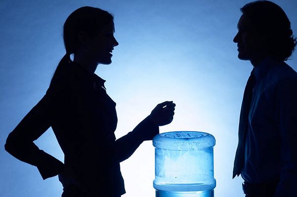 Silhouette of people talking at water cooler 2.jpg