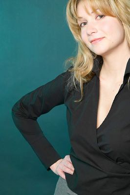 Smiling blonde with hands on hip uid 1452994.jpg