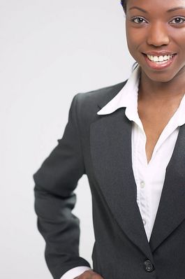 Smiling businesswoman in black suit.jpg