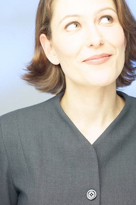 Smiling businesswoman looking upwards.jpg