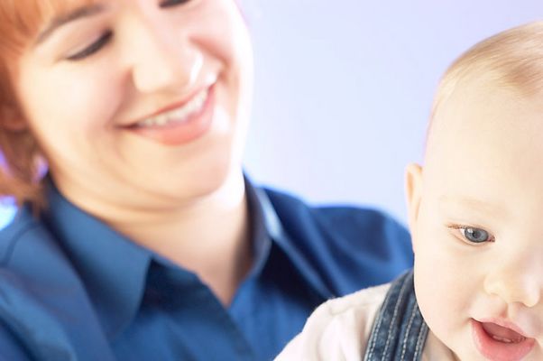 Smiling woman holding baby an 1.jpg