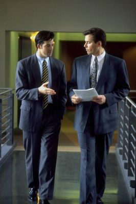 Two men in suits walking.jpg