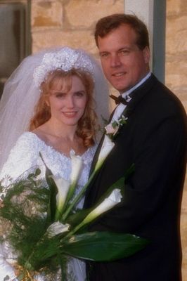 Wedding photo of couple with flowers.jpg