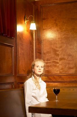 Woman drinking glass of red wine in bar.jpg