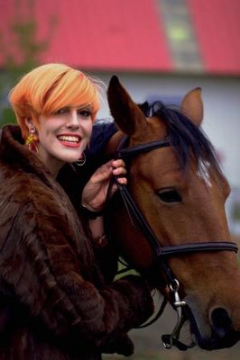 Woman holding horse.jpg