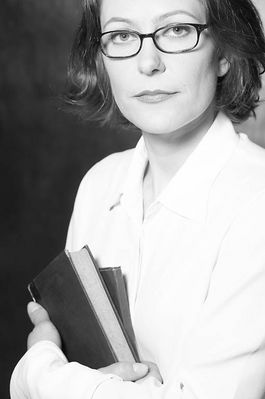 Woman in eyeglasses holding books 2.jpg