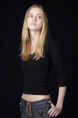 Woman in front of black background uid 1426766.jpg
