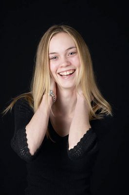 Woman in front of black background uid 1426769.jpg