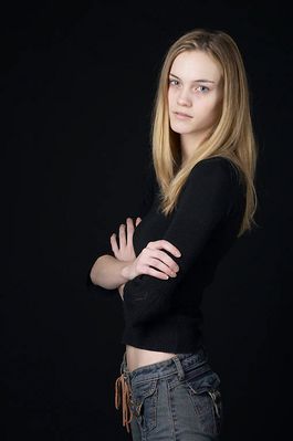 Woman in front of black background uid 1426782.jpg