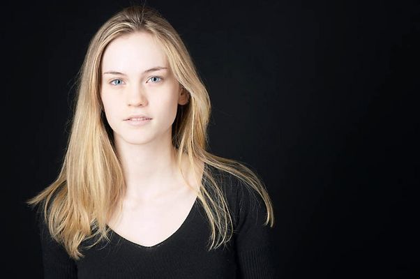 Woman in front of black background uid 1426797.jpg