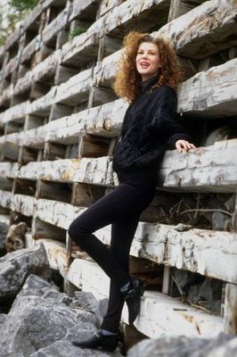 Woman leaning against wooden ladder.jpg