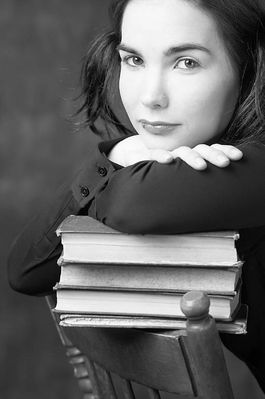 Woman leaning on pile of books 2.jpg