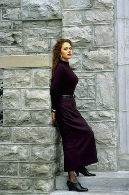 Woman leaning on stone post.jpg