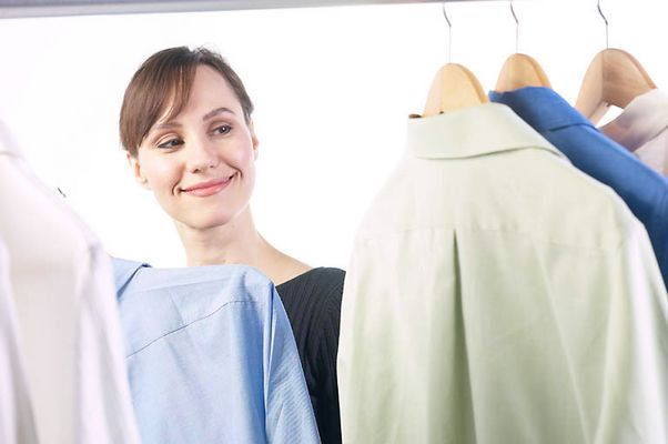 Woman picking out a shirt uid 1343149.jpg