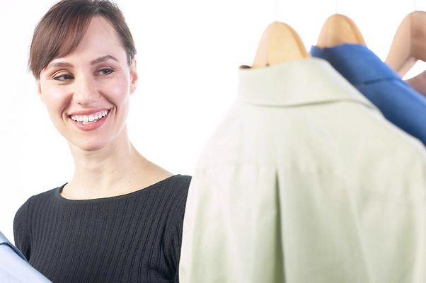 Woman picking out a shirt uid 1343150.jpg
