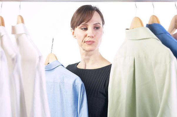 Woman picking out a shirt.jpg