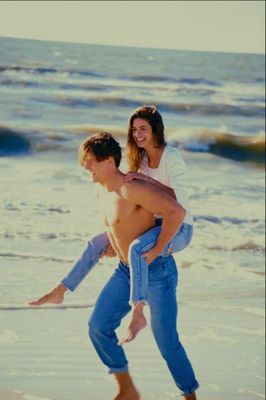 Woman riding piggyback on man.jpg