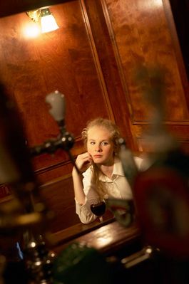 Woman sitting at table in bar.jpg