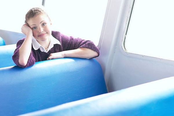 Woman sitting in blue vinyl seat uid 1283660.jpg