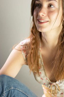 Woman sitting in jeans and floral top a89.jpg